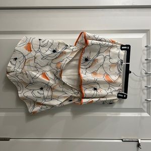 Strapless white romper and opening at midsection